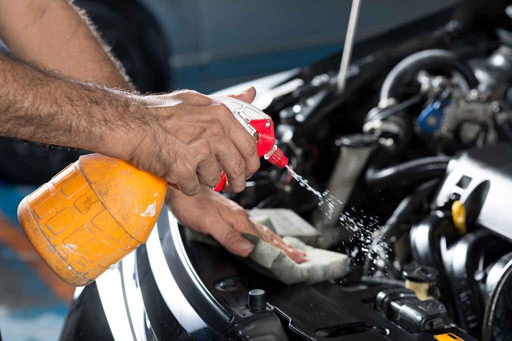 Cleaning car engine with spray-on cleaner